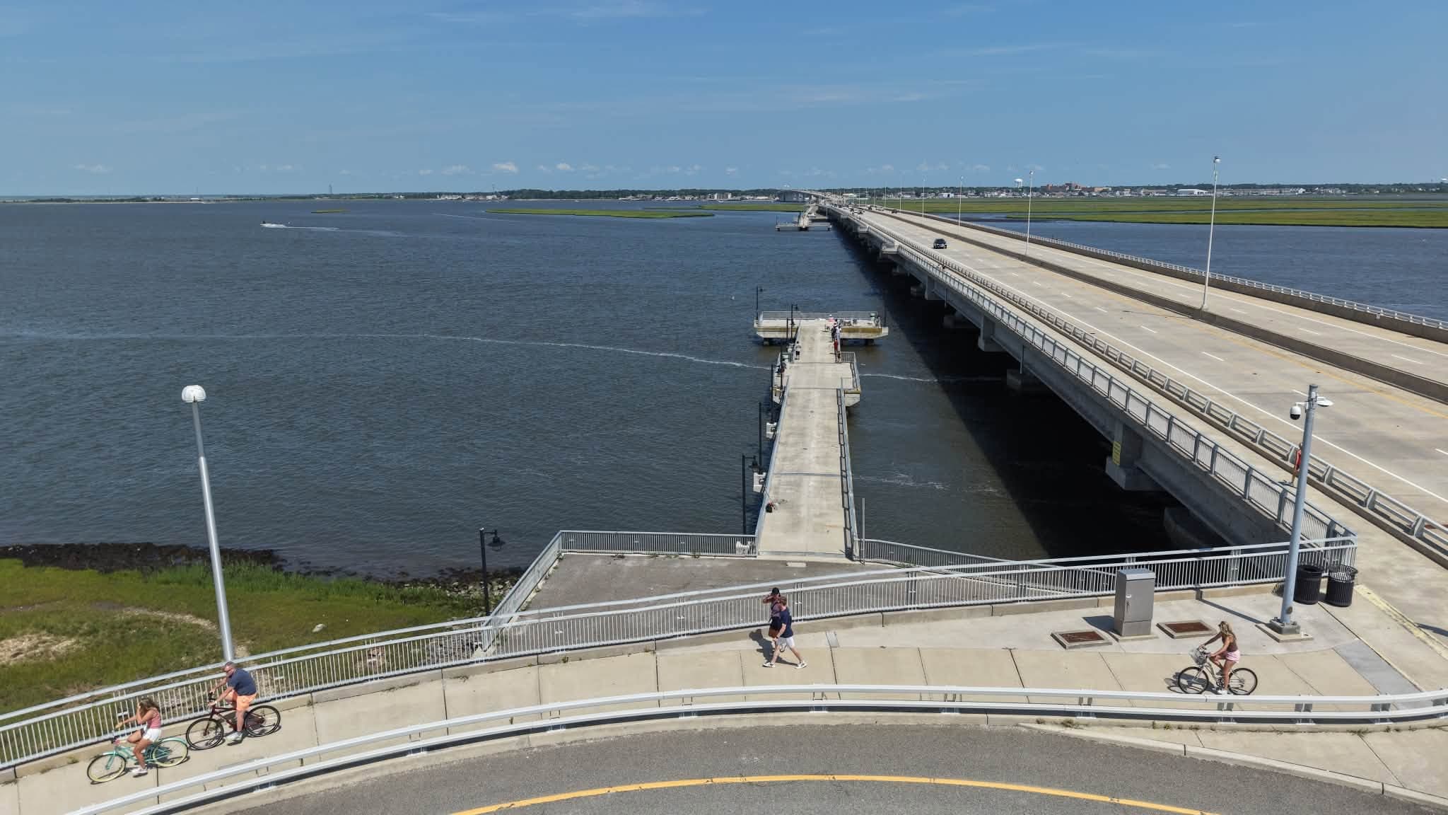 Aerial view of a South Jersey bay causeway bridge with cyclists and pedestrians crossing